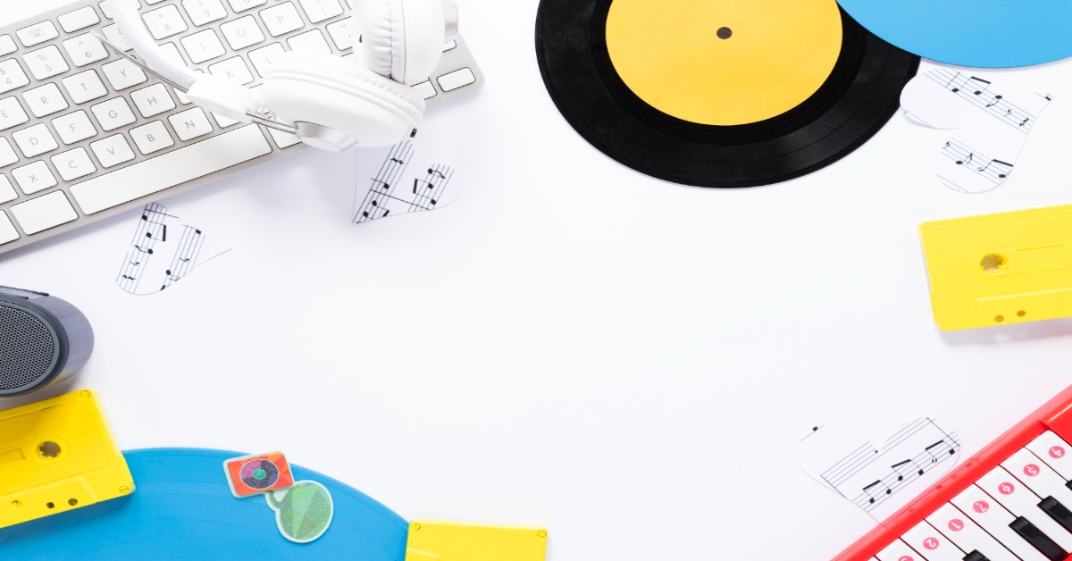 Music equipment and accessories on a white table, illustrating how to choose music for corporate videos.