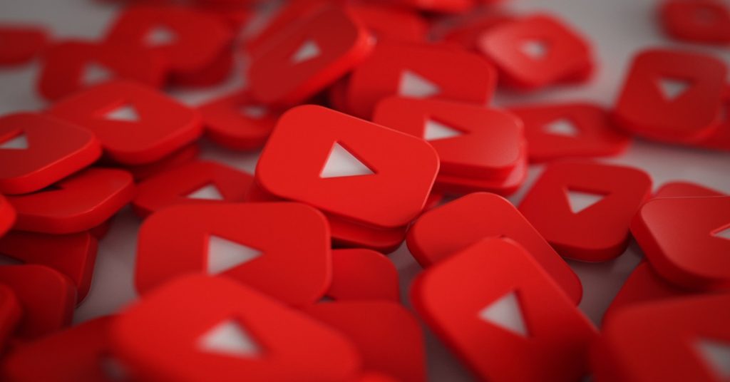 Red YouTube logo illustrating the concept of multi-language videos and best practices for uploading content.