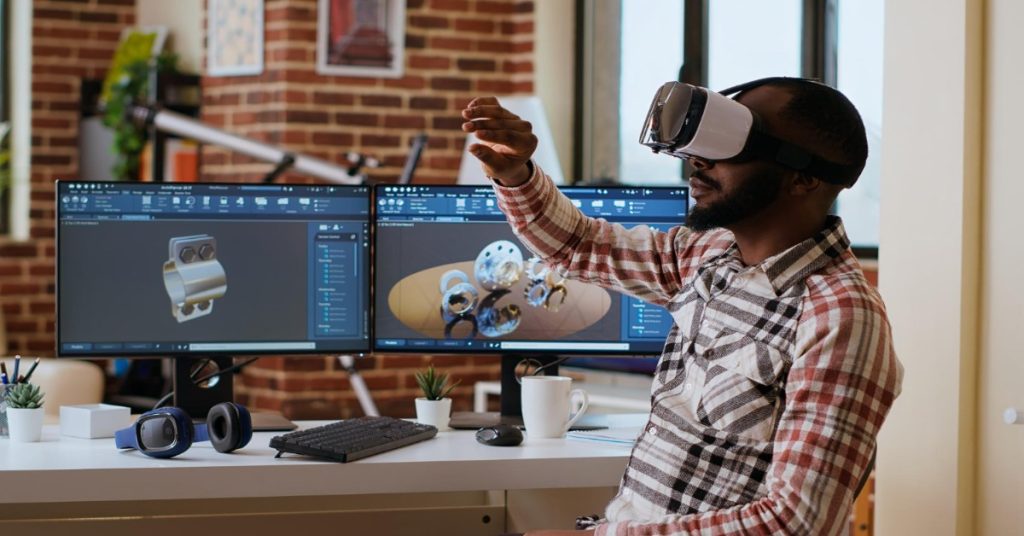 A man at his desk wearing virtual reality glasses, immersed in a digital experience related to corporate video production.