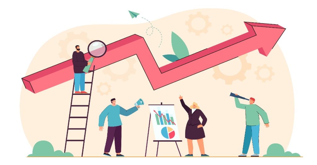 Businesspeople discuss corporate video production trends while standing around a chart.