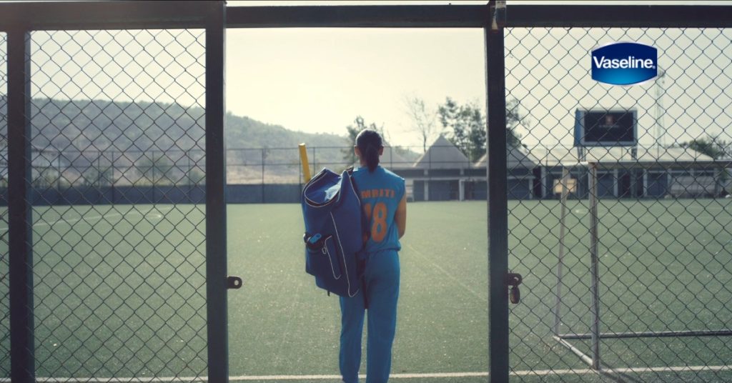 A person poses with a bat near a fence, representing the Vaseline campaign, made by using VFX software DaVinci Resolve.